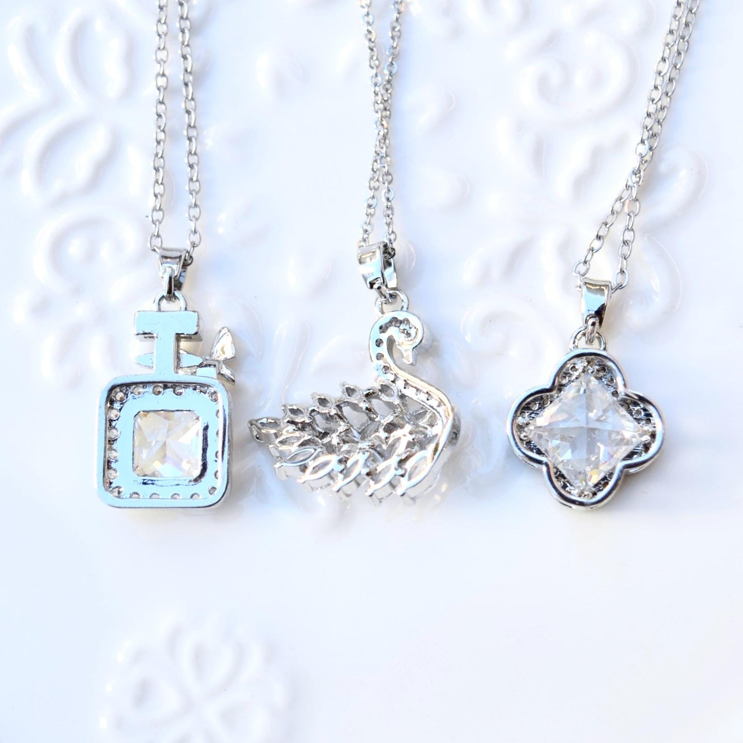 Silver White Crystal Charm Necklace: Perfume Bottle Swan Clover