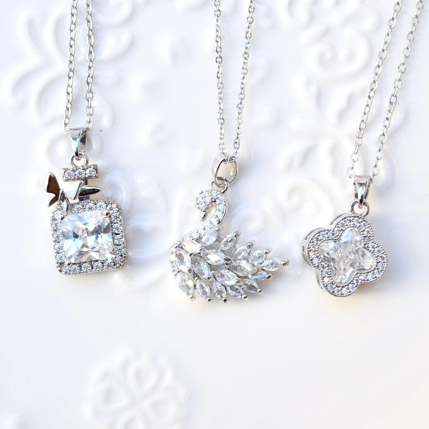 Silver White Crystal Charm Necklace: Perfume Bottle Swan Clover