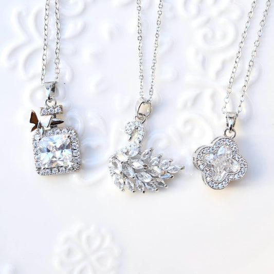 Silver White Crystal Charm Necklace: Perfume Bottle Swan Clover