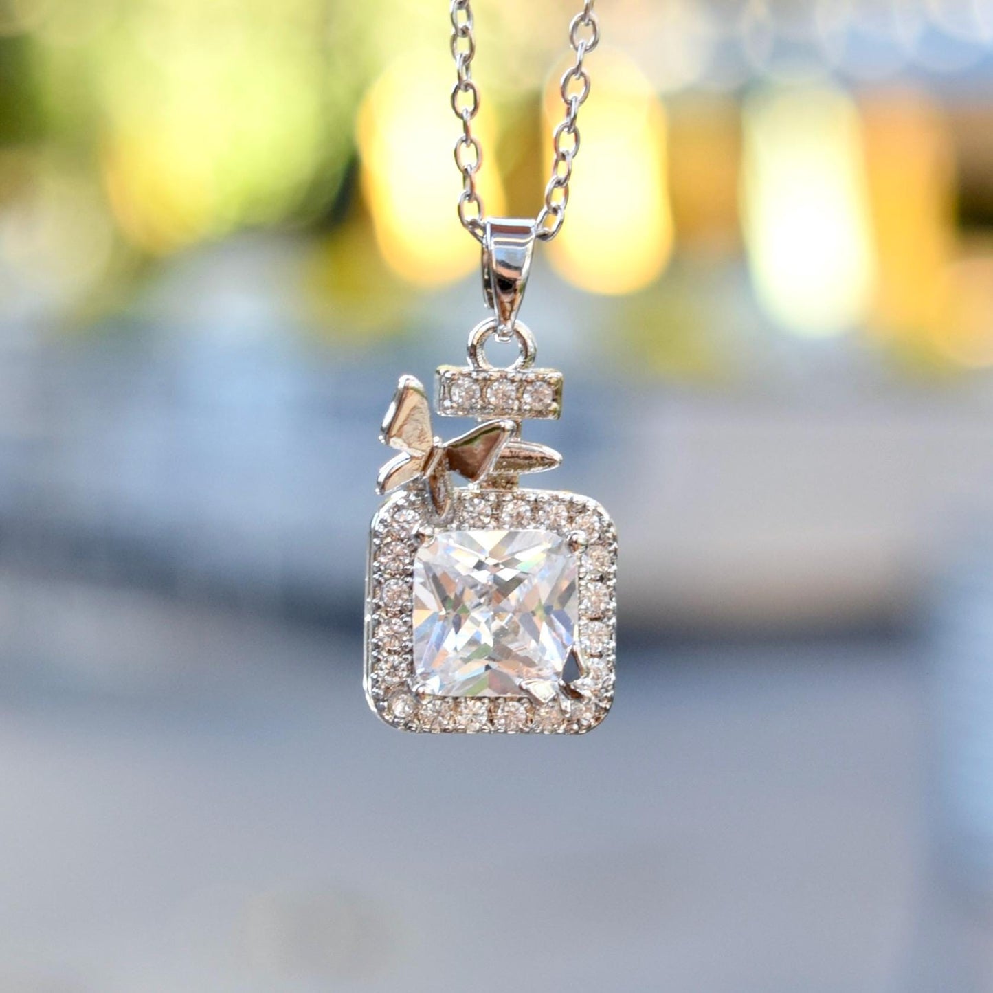 Silver White Crystal Charm Necklace: Perfume Bottle Swan Clover